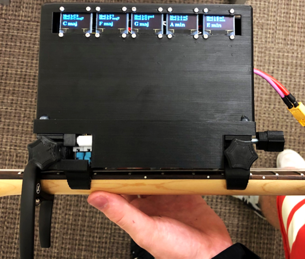 OLED screens display the currently programmed chords and their modifiers